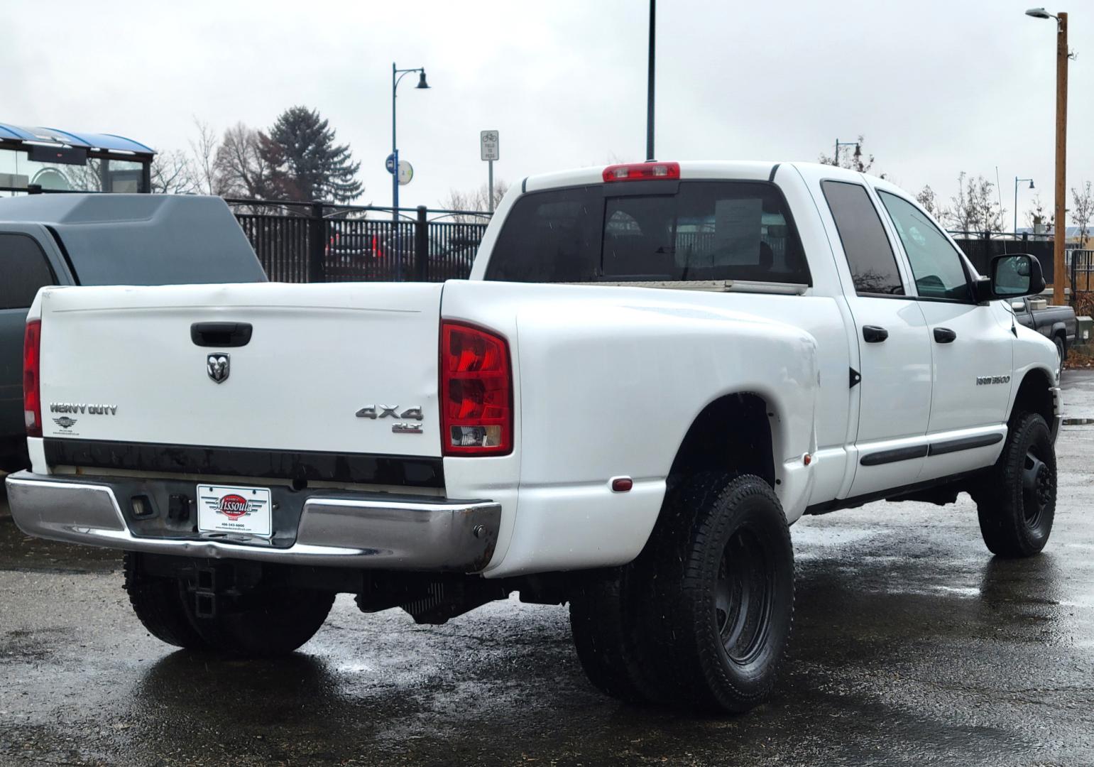 2005 White /Black Dodge Ram 3500 SLT (3D7LS38C85G) with an 5.9L I6 24V Cummins engine, 6 Speed Manual transmission, located at 450 N Russell, Missoula, MT, 59801, (406) 543-6600, 46.874496, -114.017433 - 4 Wheel Drive. One Ton Dually. Long Box. 6 Speed Manual Transmission. Has a lot of miles but runs amazingly. Air Cruise. Tilt. Power Windows and Locks. Power Drivers Seat. AM FM CD XM. 1 Owner. Clean Carfax. There is no financing options on this vehicle. - Photo#5